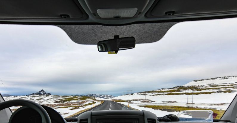 Iceland Ring Road - Vehicle in Between Snow Covered Field