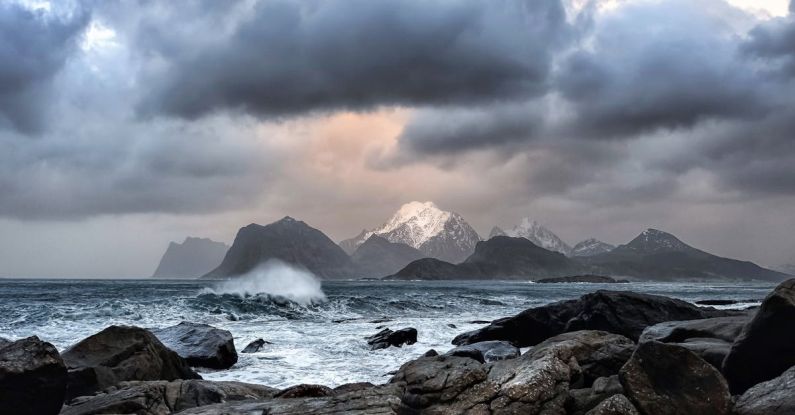 Norwegian Fjords - Waves Crashing on Rock Near Mountains during Datyime