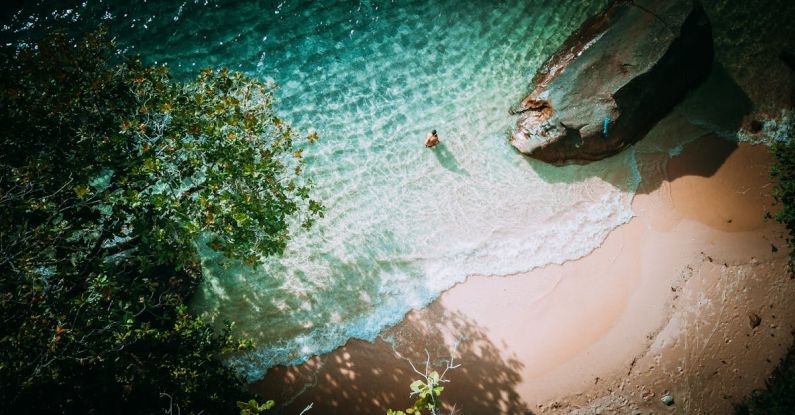 Seychelles Beach - Top View Of A Lone Person on Seashore