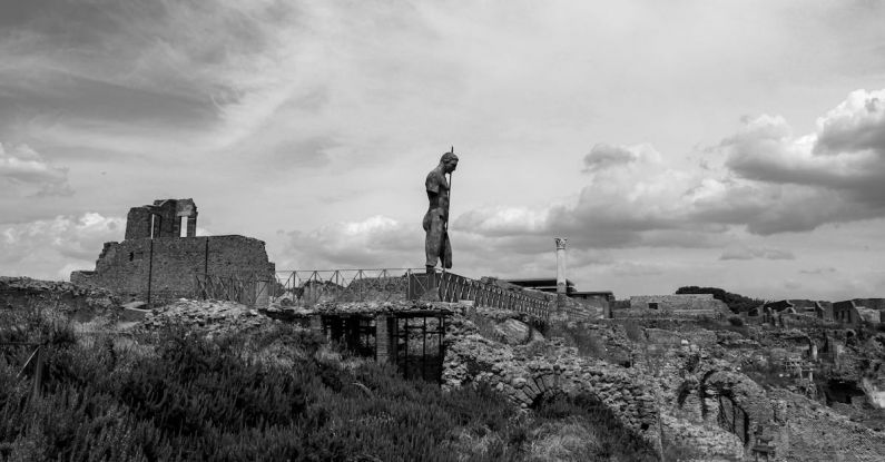 Pompeii Ruins - Grayscale Photo of Monumental Sculpture on Top of Ruins