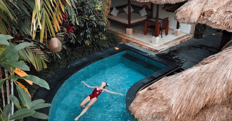 Bali Villa - Woman Soaking on the Swimming Pool